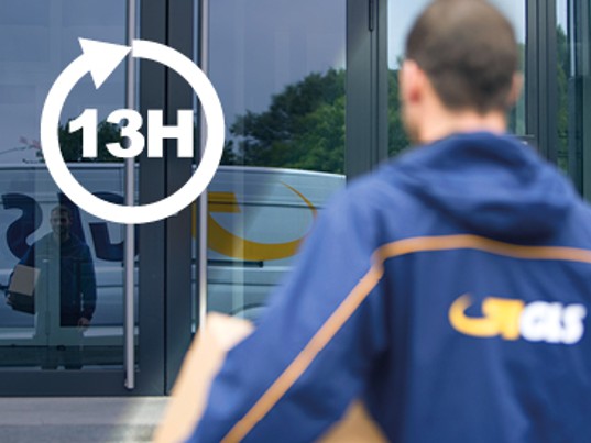Chauffeur GLS France livre avant 13h immeuble porte en verre